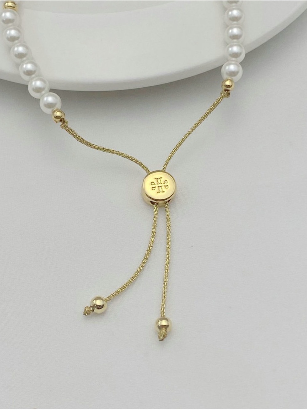 Tory Burch Gold and White Pearl Logo Adjustable Bracelet - Picture 4 of 5